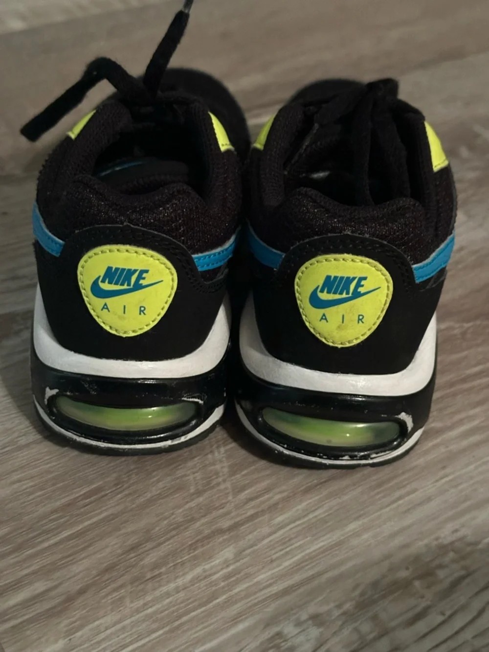 Nike Kids Black Sneakers with Blue Swoosh and Neon Yellow Accents